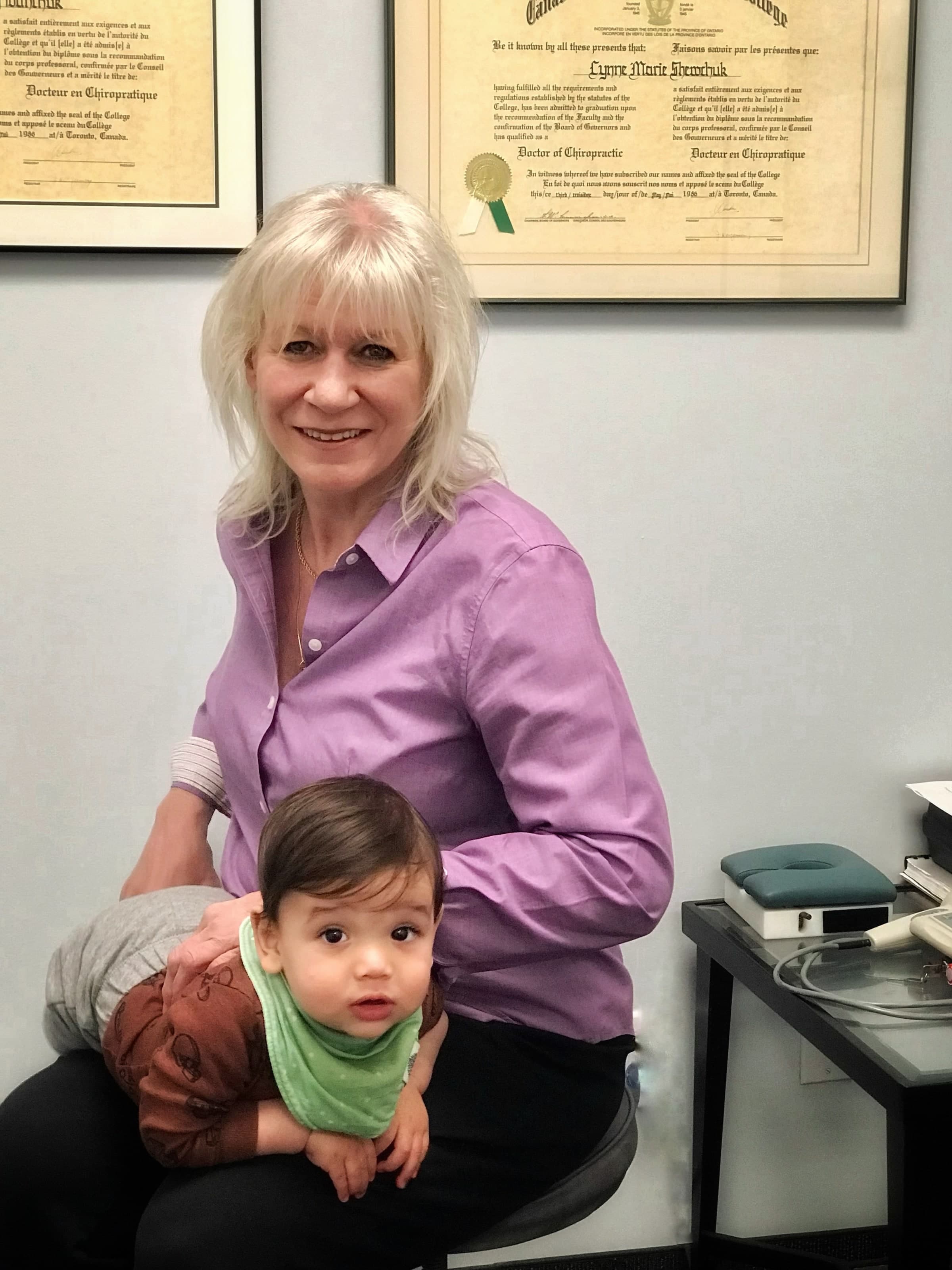 Dr. Lynne Shewchuk holds an infant patient at Life Chiropractic Centre in Burlington, Ontario