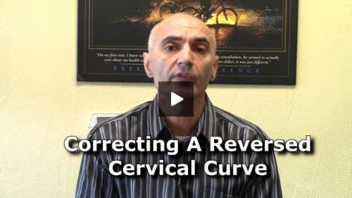 A chiropractor in a striped shirt speaks to the camera with text overlay reading "Correcting A Reversed Cervical Curve